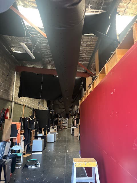Second view of the same studio space and the black fabric duct along the ceiling.